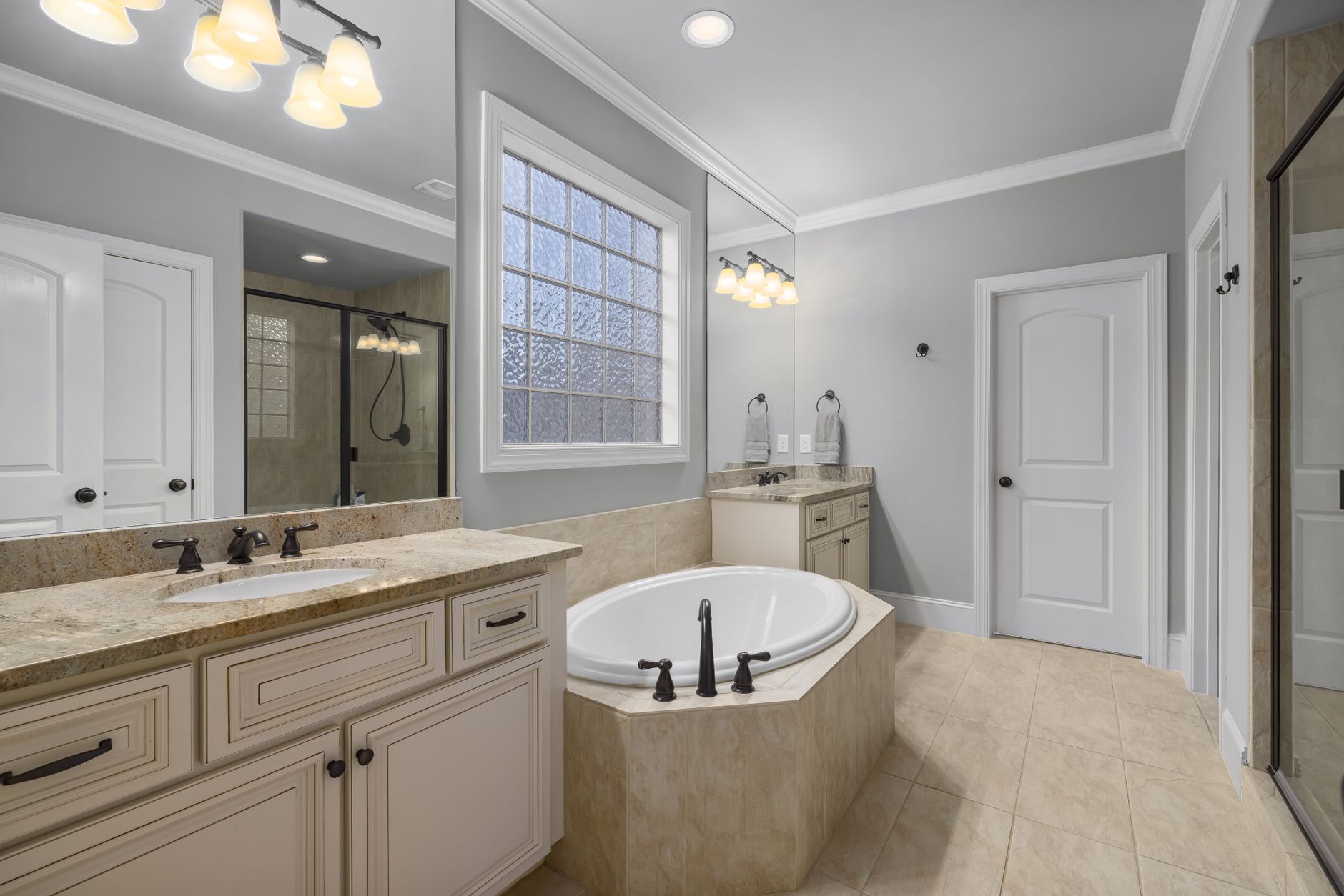 Elegant bathroom featuring a freestanding tub, stylish amenities, and neutral decor in Riverside, CA